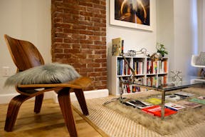 Minimalist mid-century modern lounge space and modern kitchen - Image 1