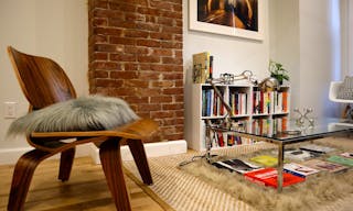 Minimalist mid-century modern lounge space and modern kitchen - Image 1