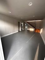 Large Empty Warehouse with high arched metal ceiling and lobby loft space - Image 3