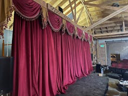 Gorgeous Space with moveable Seats and Red Velvet Curtains - Image 12