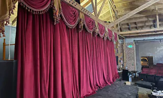Gorgeous Space with moveable Seats and Red Velvet Curtains - Image 12