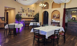 Elegant Restaurant Dining Space with TV's and Full Bar - Image 2