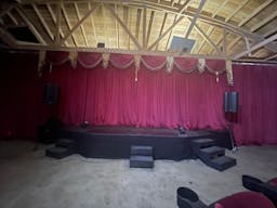 Gorgeous Space with moveable Seats and Red Velvet Curtains - Image 33