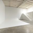 High-ceiling photo studio with a cyclorama wall