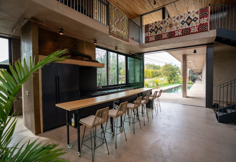 Concrete Oasis: A Villa Retreat with Poolside Serenity - Image 4