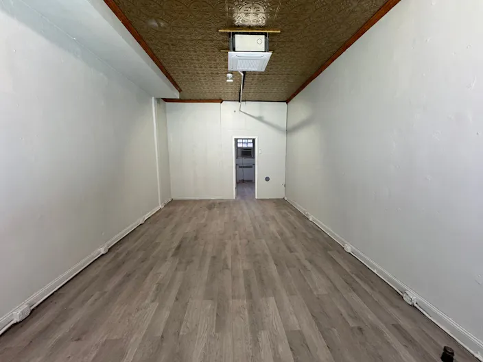 Store Front in the heart of the Lower East Side in NYC. Blank slate do what you want in a fully built out space. - Image 1