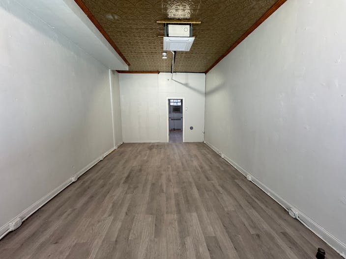 Store Front in the heart of the Lower East Side in NYC. Blank slate do what you want in a fully built out space. - Image 1