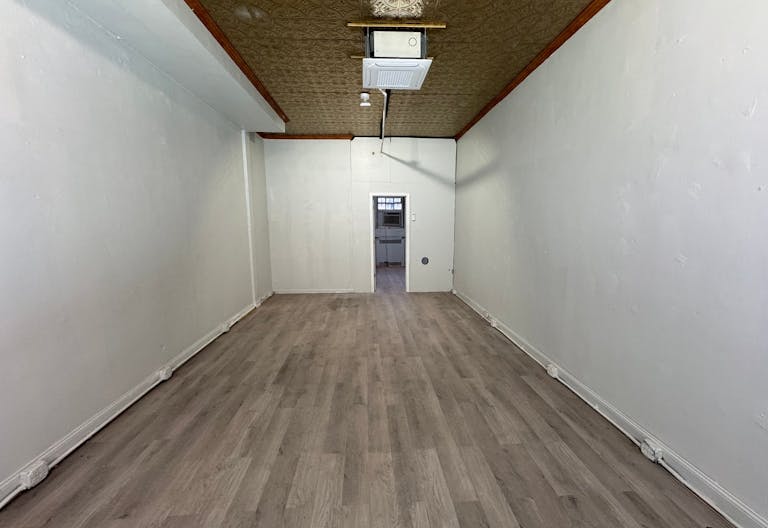 Store Front in the heart of the Lower East Side in NYC. Blank slate do what you want in a fully built out space. - Image 1