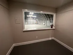 Large Empty Warehouse with high arched metal ceiling and lobby loft space - Image 7