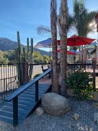 Vintage Train Car in Rustic Setting - Image 2