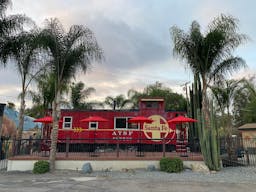 Vintage Train Car in Rustic Setting - Image 0