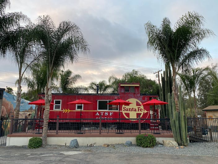 Vintage Train Car in Rustic Setting - Image 0