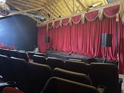 Gorgeous Space with moveable Seats and Red Velvet Curtains - Image 7