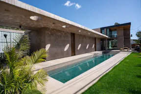 Concrete Oasis: A Villa Retreat with Poolside Serenity - Image 0