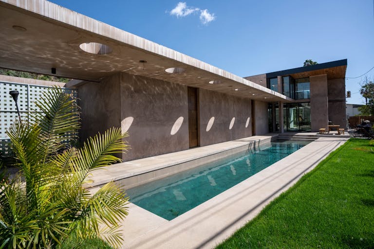 Concrete Oasis: A Villa Retreat with Poolside Serenity - Image 0