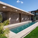 Concrete Oasis: A Villa Retreat with Poolside Serenity