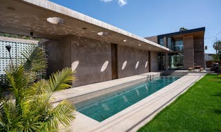 Concrete Oasis: A Villa Retreat with Poolside Serenity - Image 0