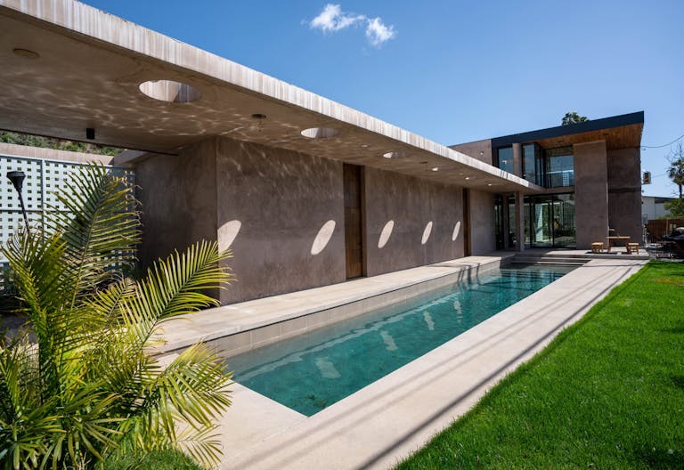 Concrete Oasis: A Villa Retreat with Poolside Serenity - Image 0