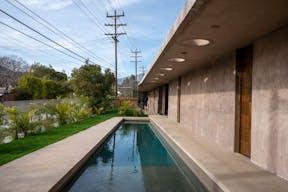 Concrete Oasis: A Villa Retreat with Poolside Serenity - Image 13