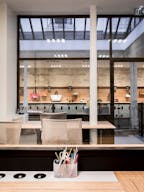 Showroom space under glass roof with natural light - Image 11