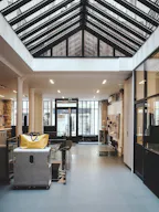 Showroom space under glass roof with natural light - Image 5