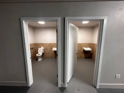 Large Empty Warehouse with high arched metal ceiling and lobby loft space - Image 8