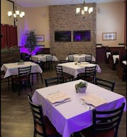 Elegant Restaurant Dining Space with TV's and Full Bar - Image 1