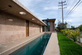 Concrete Oasis: A Villa Retreat with Poolside Serenity - Image 11