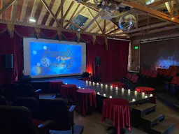 Gorgeous Space with moveable Seats and Red Velvet Curtains - Image 2