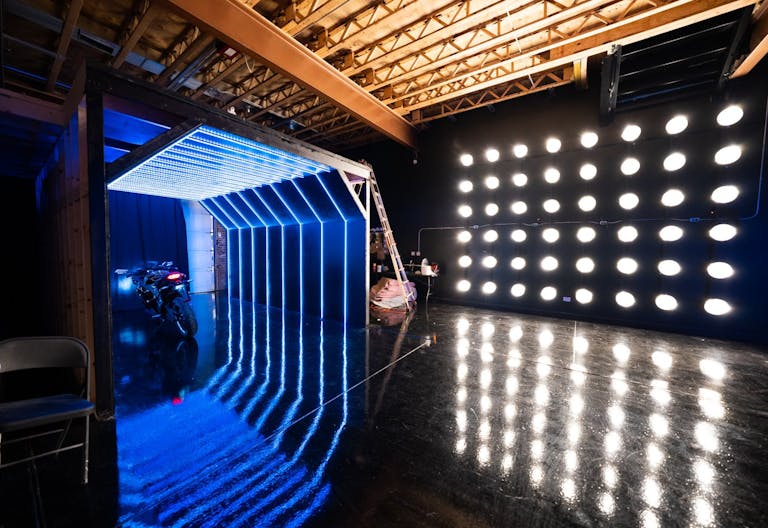 Large blackout studio with high ceilings, a Sport Bike, controllable sound synchronized RGB Lights, and RGB Tunnel for car photo and video shoots - Image 0