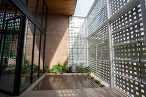 Concrete Oasis: A Villa Retreat with Poolside Serenity - Image 2