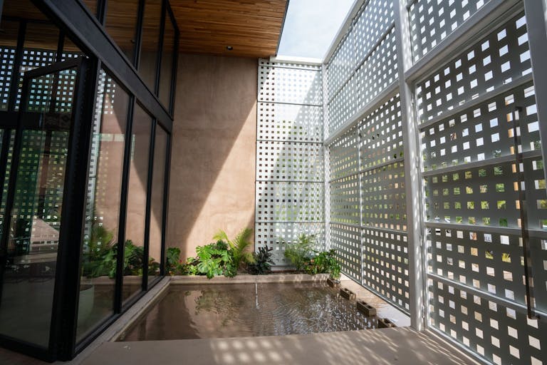 Concrete Oasis: A Villa Retreat with Poolside Serenity - Image 2