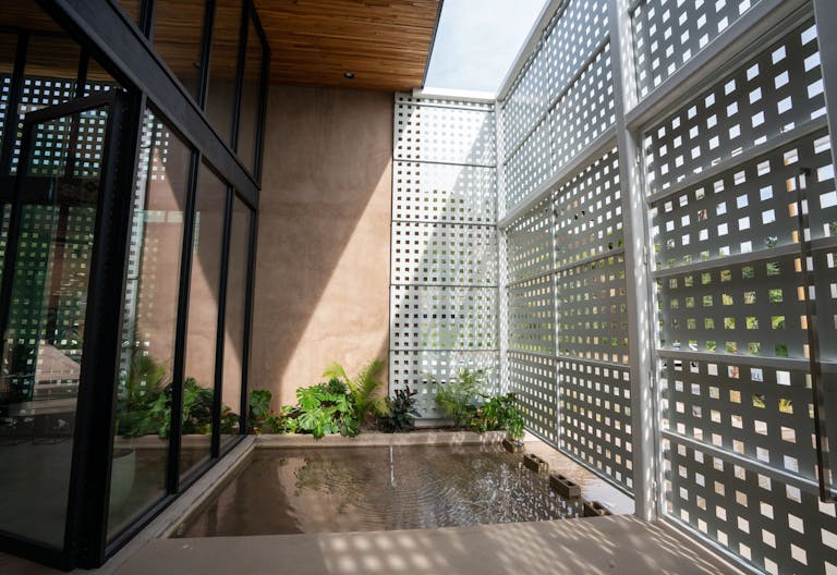 Concrete Oasis: A Villa Retreat with Poolside Serenity - Image 2