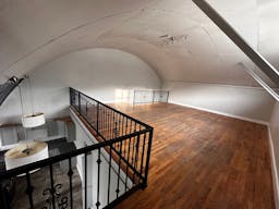 Large Empty Warehouse with high arched metal ceiling and lobby loft space - Image 5
